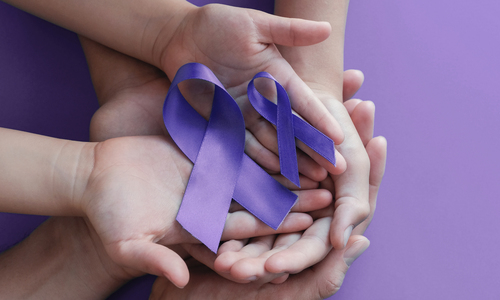 Alzheimer Care Adult and child hands holding purple ribbons, Alzheimer's disease, Pancreatic cancer, Epilepsy awareness, world cancer day on purple background