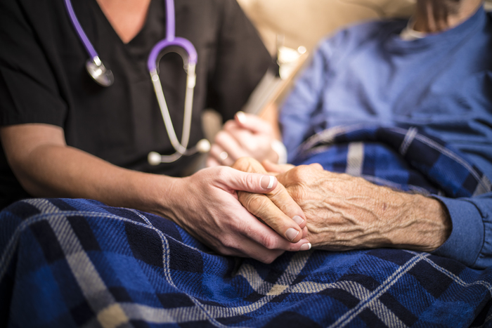 Hospice Nurse visiting an elderly male patient Hospice Nurse visiting an elderly male patient